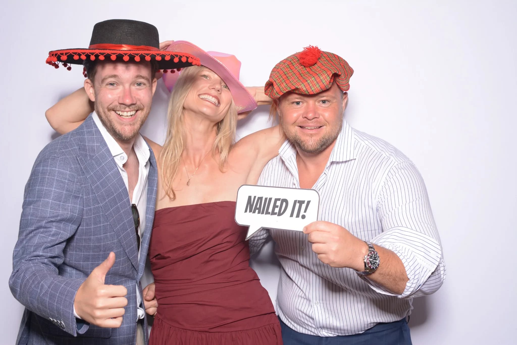 Dressed-up guests enjoying a photo booth session