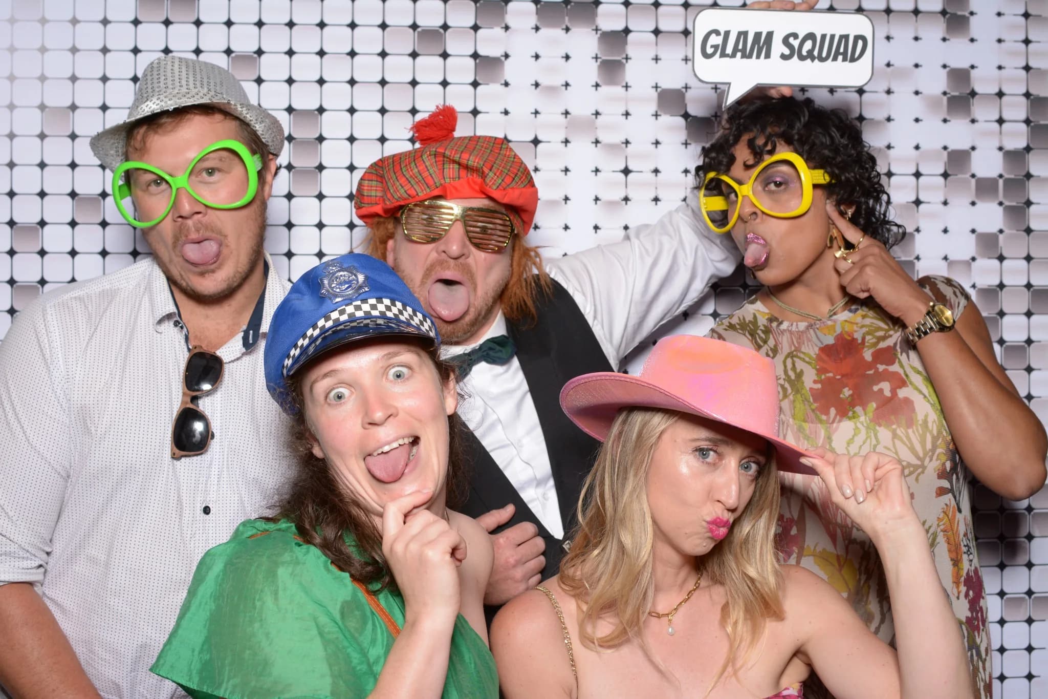 Friends making memories together in the photo booth