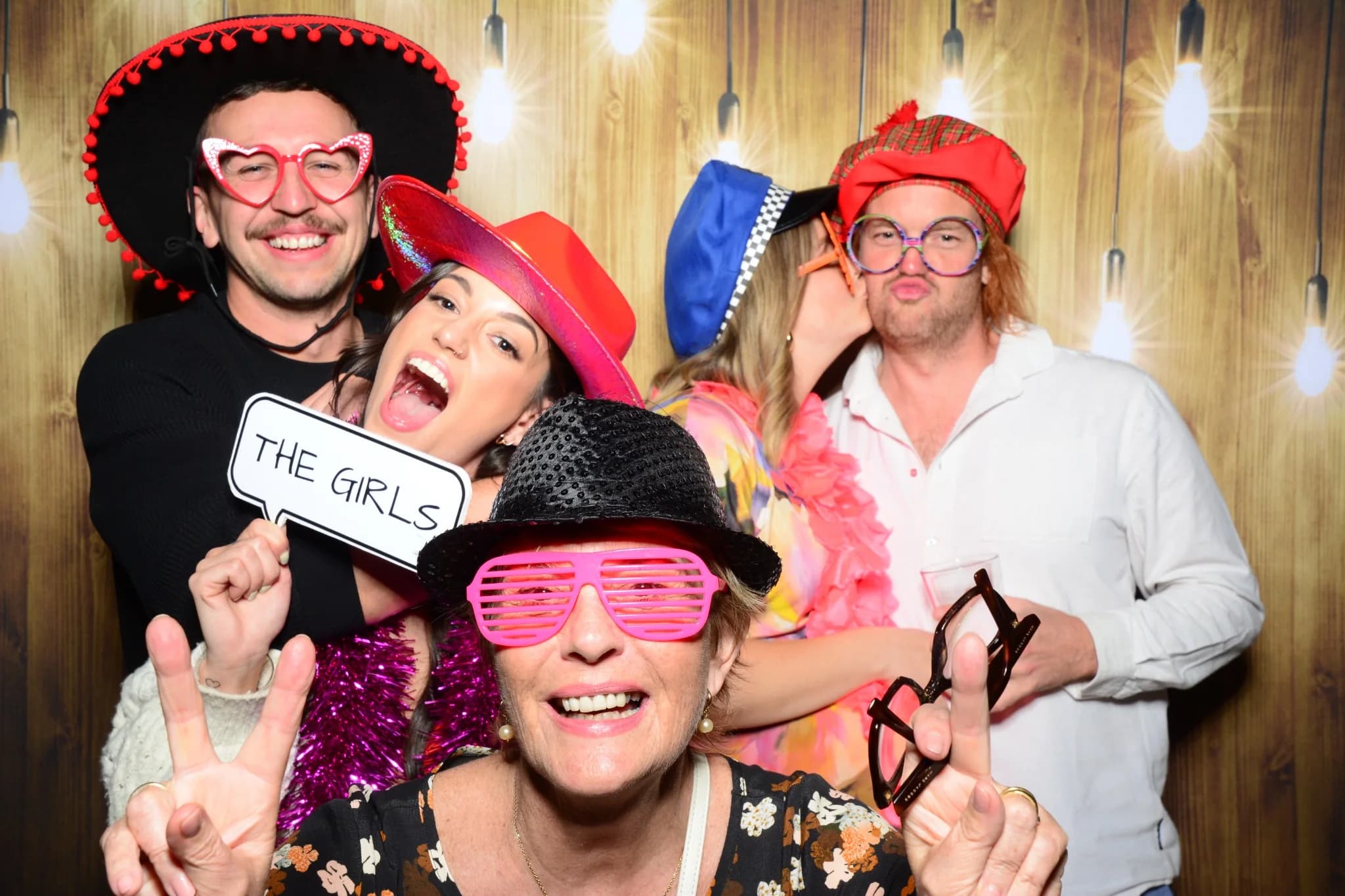 A group of friends enjoying the photo booth